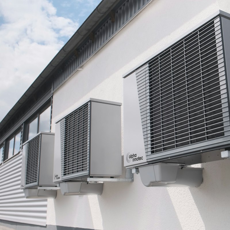 Commercial split system condensers mounted on an exterior wall